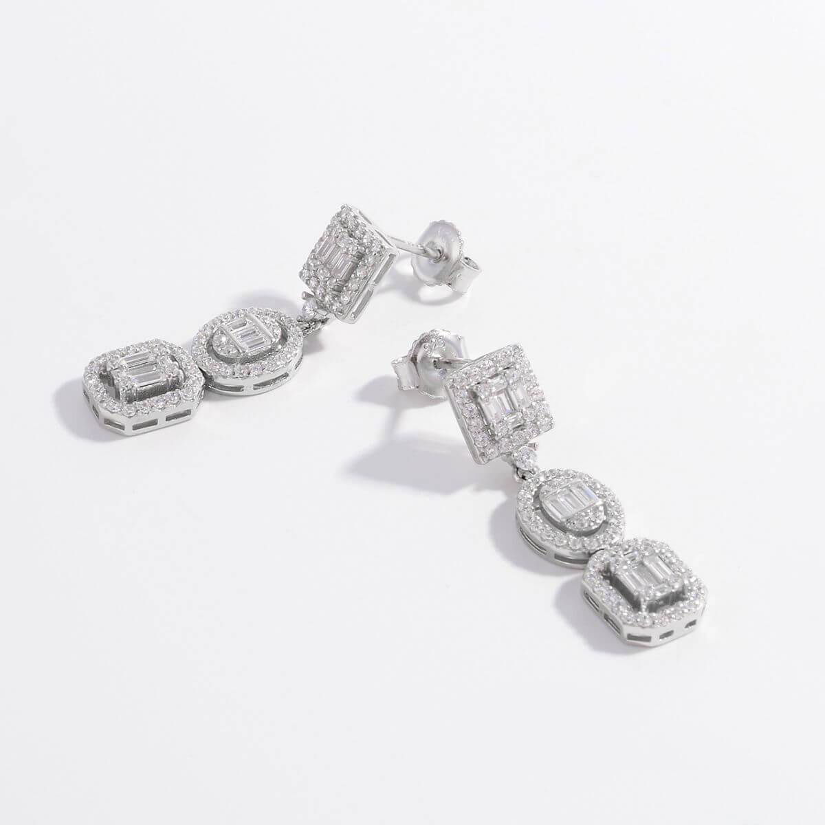 925 sterling silver inlaid zircon earrings with geometric design and three drop segments on white background