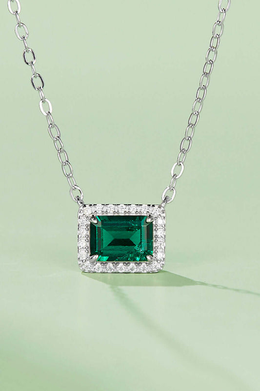 Lab-grown emerald rectangle pendant necklace in platinum-plated sterling silver with zircon accents on a minimalist chain.