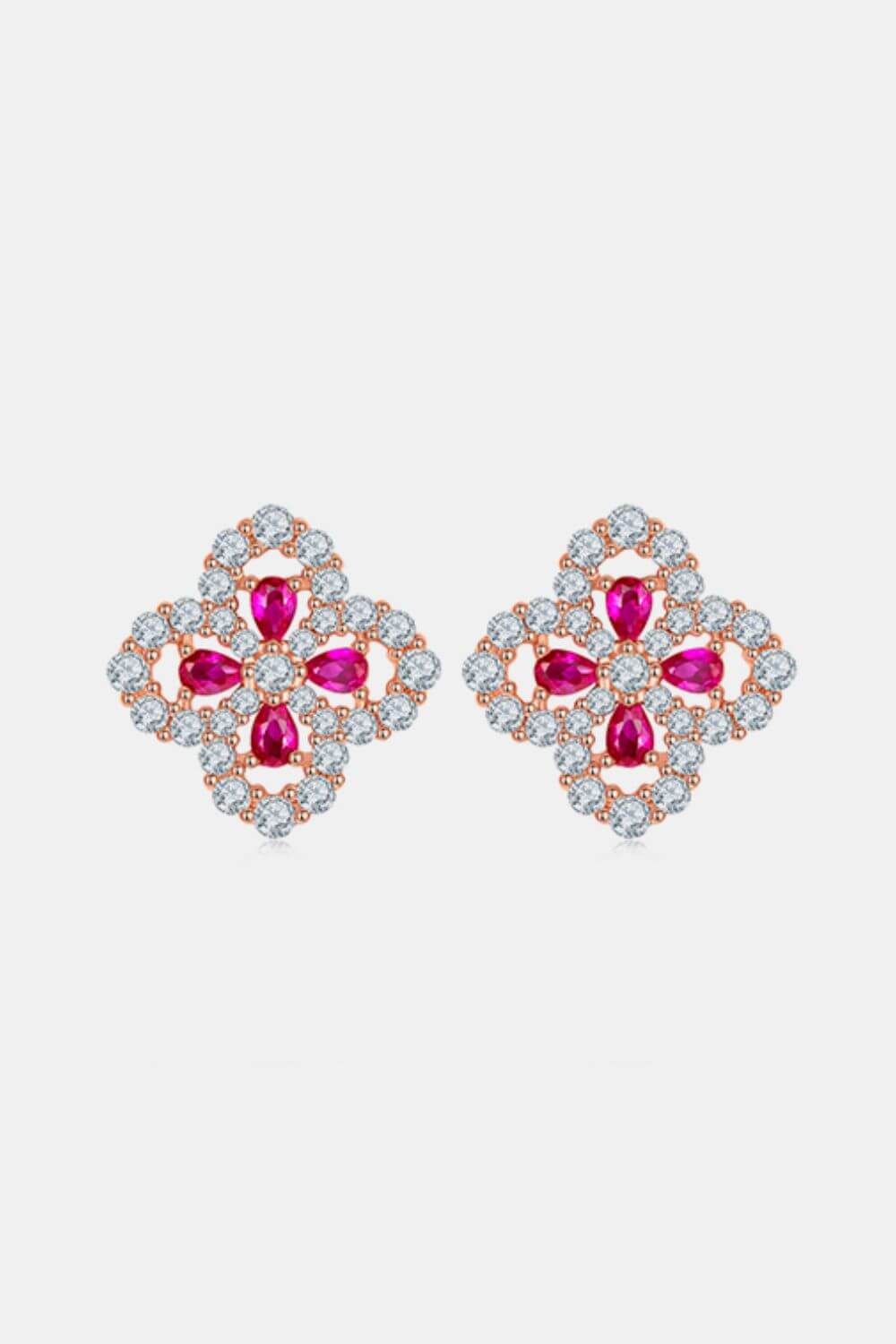 Sterling silver flower-shaped stud earrings with lab-grown rubies.