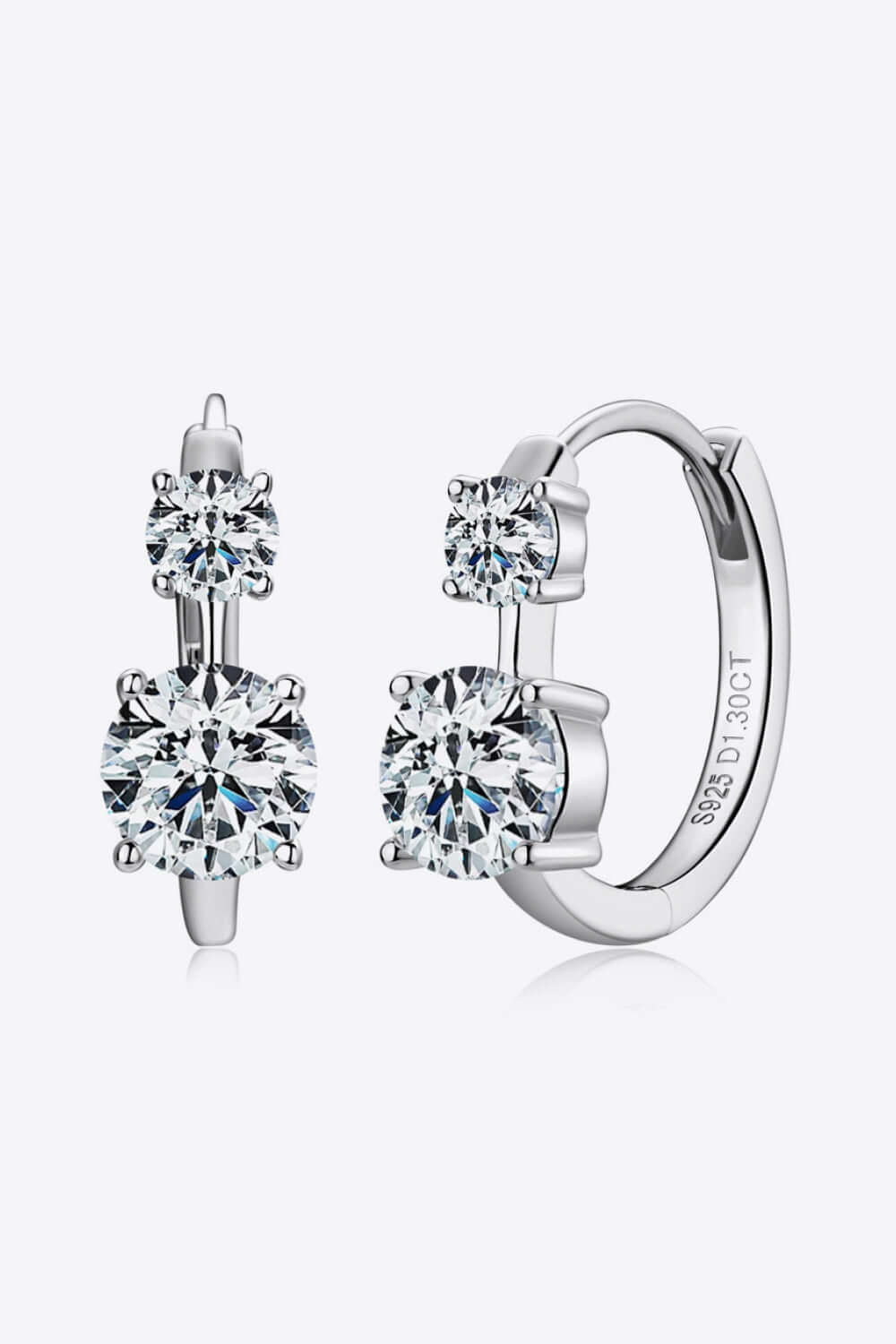 Moissanite 925 sterling silver earrings with a 1.3 carat stone, platinum-plated finish, displayed with certificate and box.