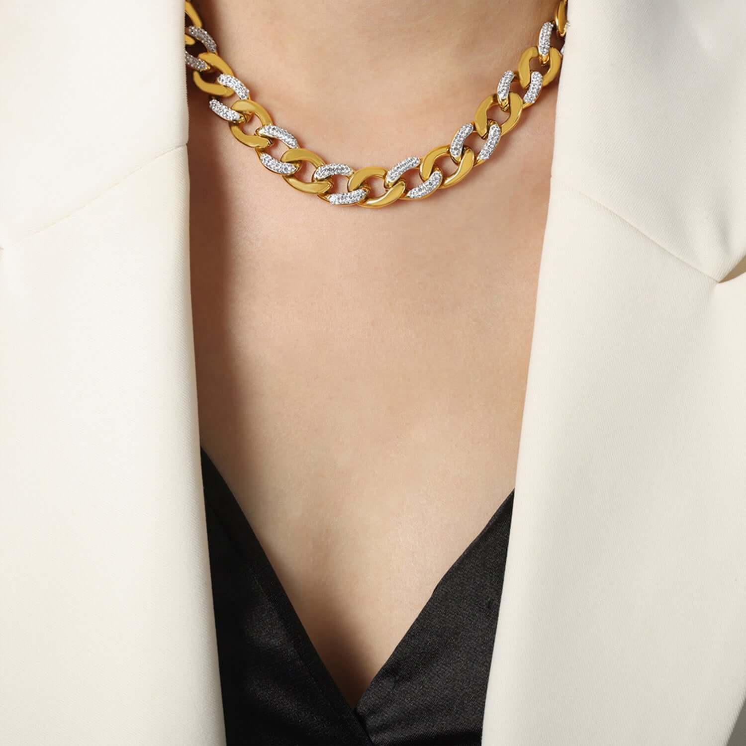 Woman wearing a zircon titanium steel chunky chain necklace with 18K gold plating.