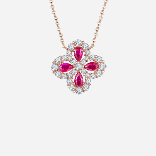 Lab-grown ruby necklace in flower shape with sterling silver and rose gold plating, featuring gem details on a delicate chain.