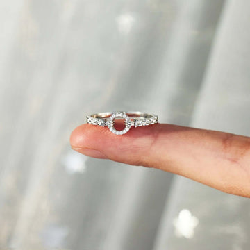 Inlaid Zircon 925 Sterling Silver Ring displayed on fingertip, showcasing intricate design and craftsmanship.