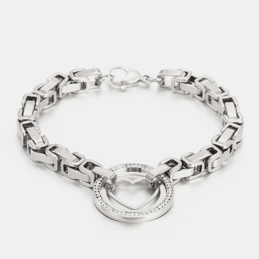 Stainless steel bracelet with a heart-shaped zircon cutout in platinum-plated and 18K gold-plated finishes.