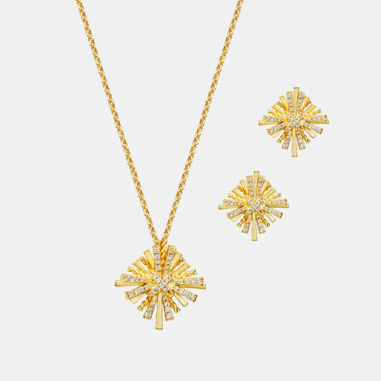 Starburst gold-plated necklace with matching zircon earrings set on white background.