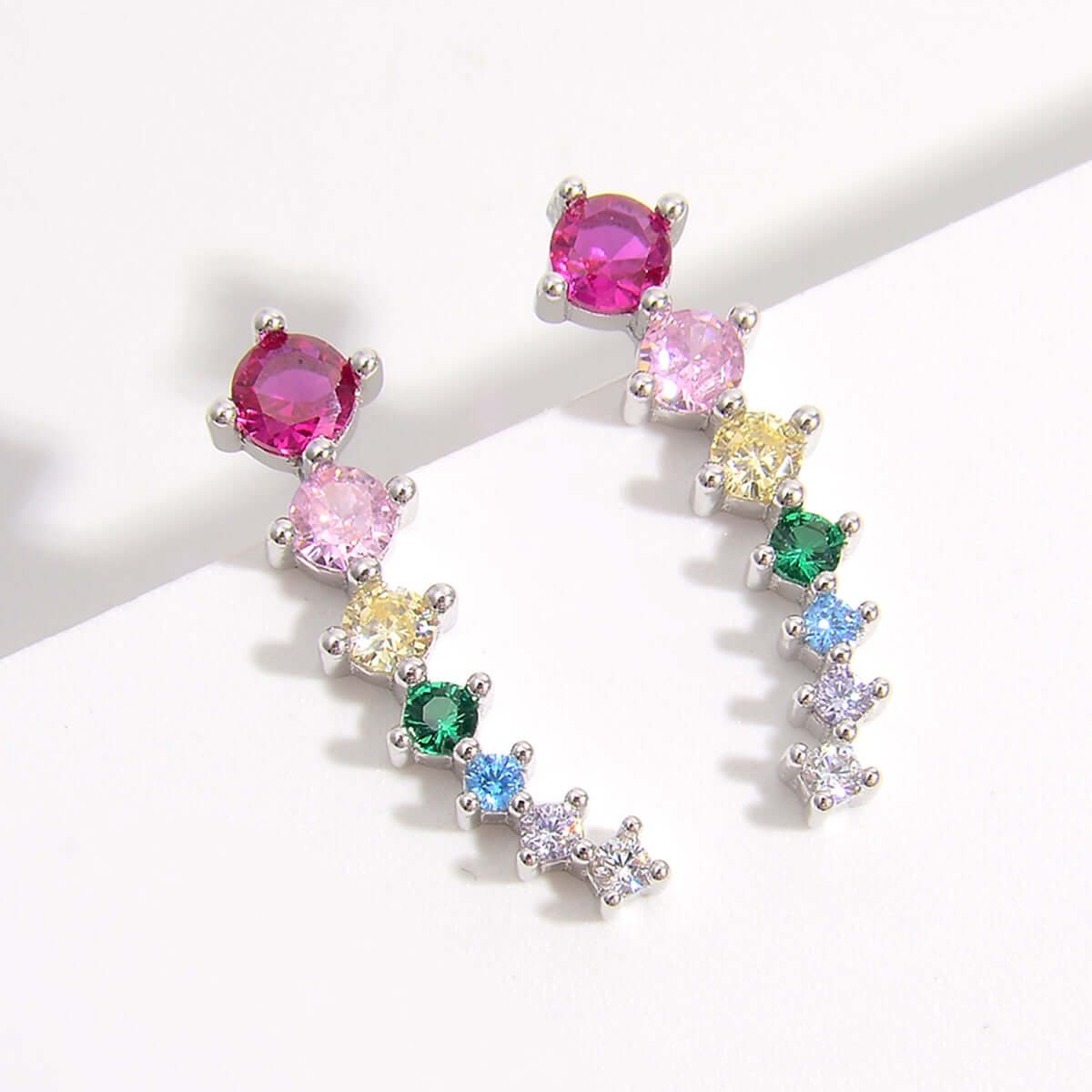 Multicolor gemstone earrings in platinum-plated 925 sterling silver, featuring vibrant zircon stones in a stylish arc design.