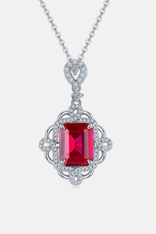 925 sterling silver necklace with cultivated ruby pendant, featuring intricate design and 16.5-inch chain length with 1.2-inch extension.