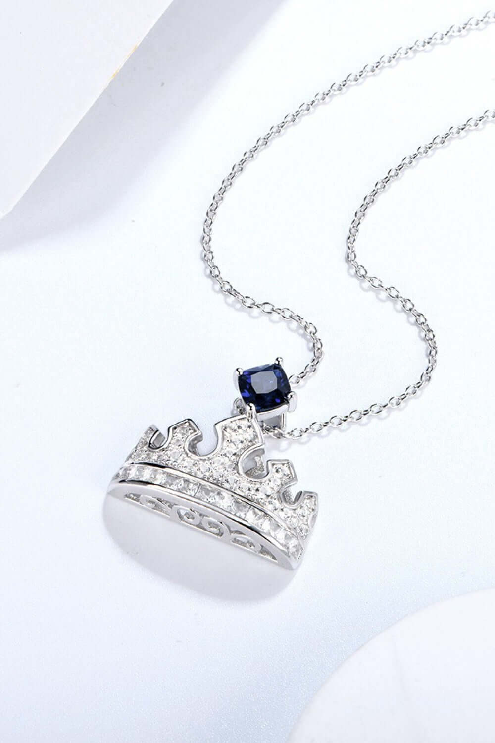 Zircon lab-grown sapphire crown shape pendant necklace in 925 sterling silver and platinum-plated, featuring minimalist design.