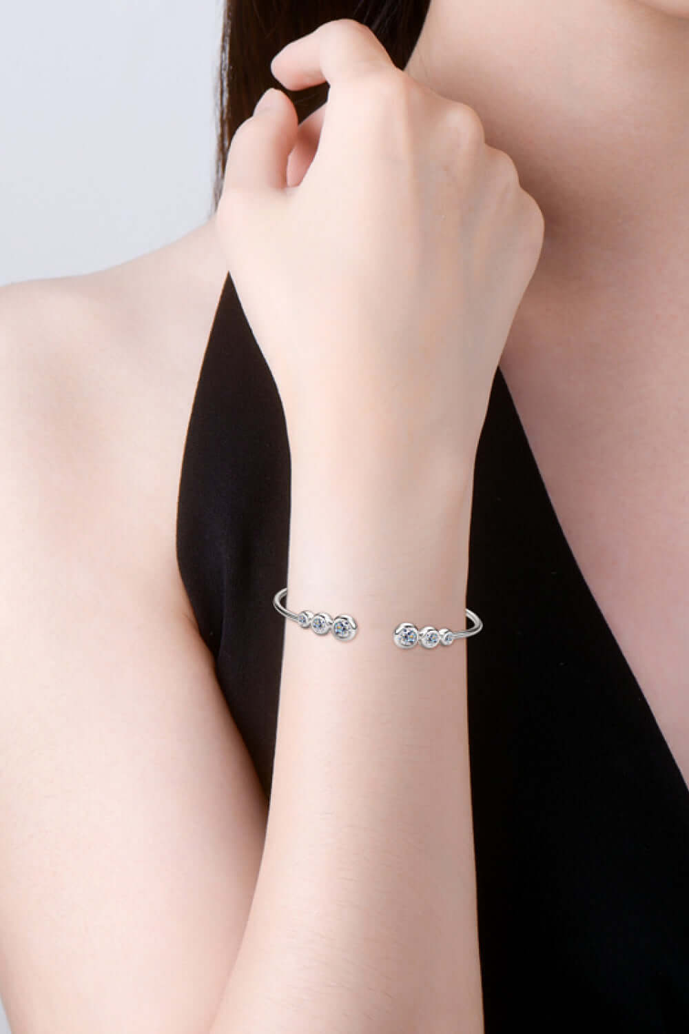 Woman wearing 1.8 carat Moissanite 925 sterling silver bracelet with elegant design.