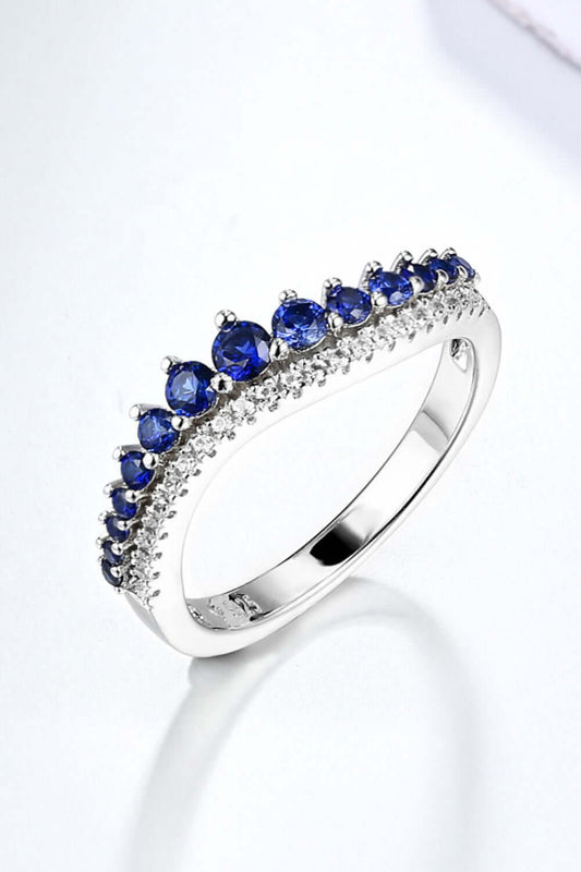 Minimalist platinum-plated 925 sterling silver ring featuring lab-grown sapphire gemstones.