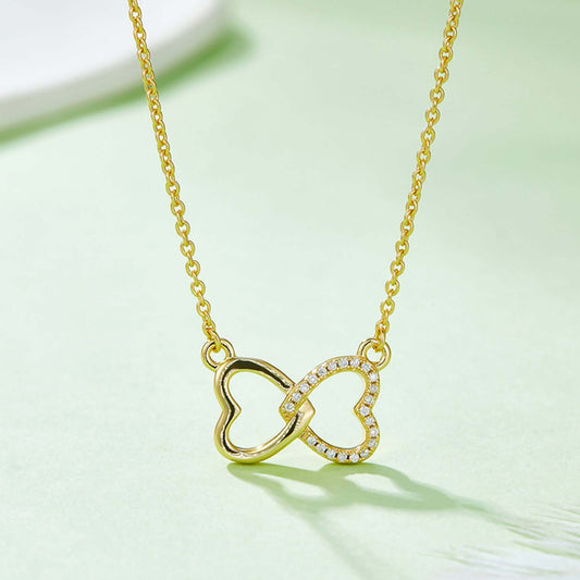 Moissanite 925 sterling silver heart bow necklace, gold-plated, intertwined hearts design on a delicate chain, elegant jewelry piece.