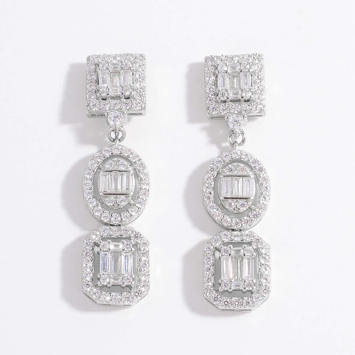 Elegant 925 sterling silver inlaid zircon earrings with sparkling design, perfect for special occasions.