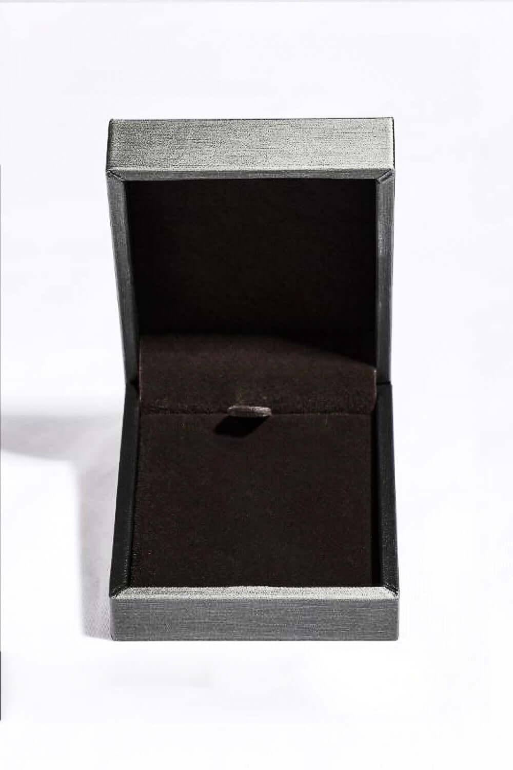 Minimalist black jewelry box with open lid, included with Zircon Lab-Grown Sapphire Crown Shape Pendant Necklace.