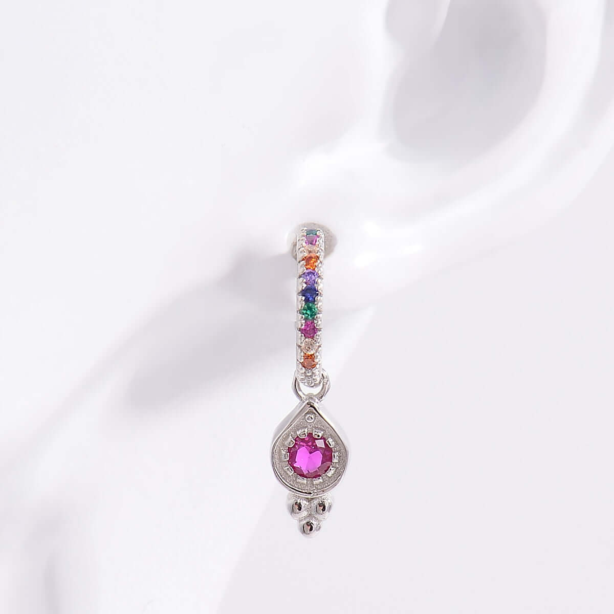 925 Sterling Silver Inlaid Zircon Earrings with Platinum-Plating and Colorful Accents on Display.