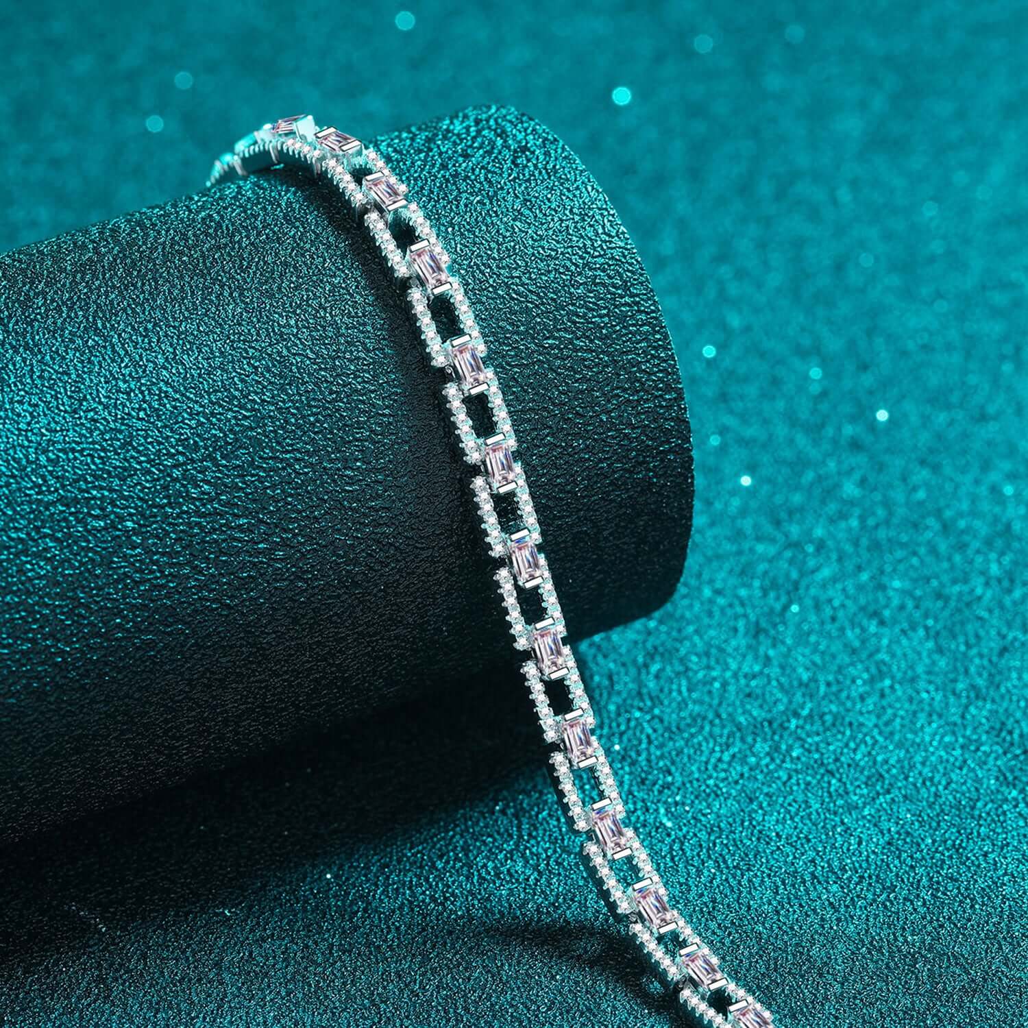 Elegant 3.2 Carat Moissanite Bracelet in 925 Sterling Silver with a shimmering chain design on a textured teal background.