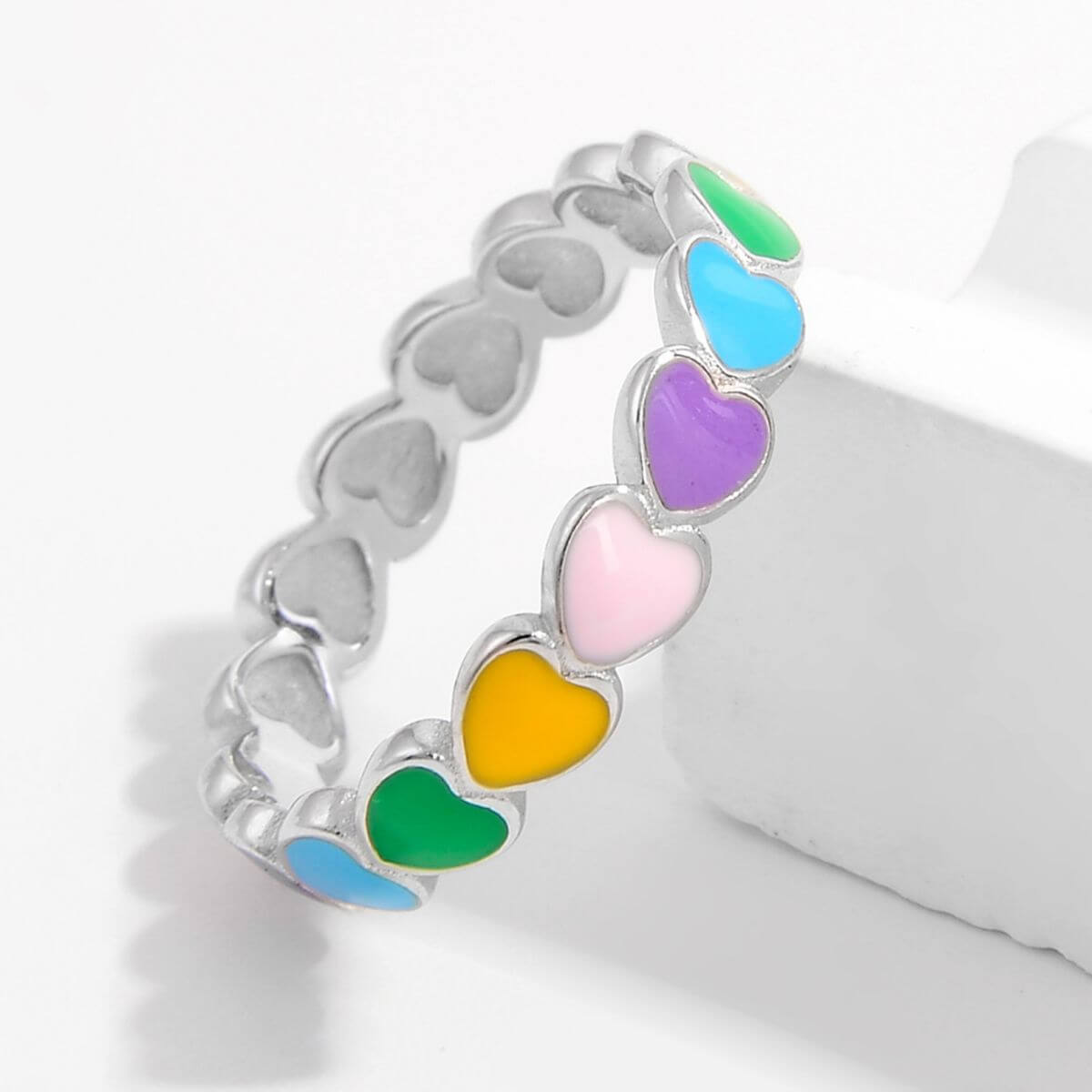 925 sterling silver ring with colorful heart-shaped drip oil accents in green, blue, purple, pink, and yellow.